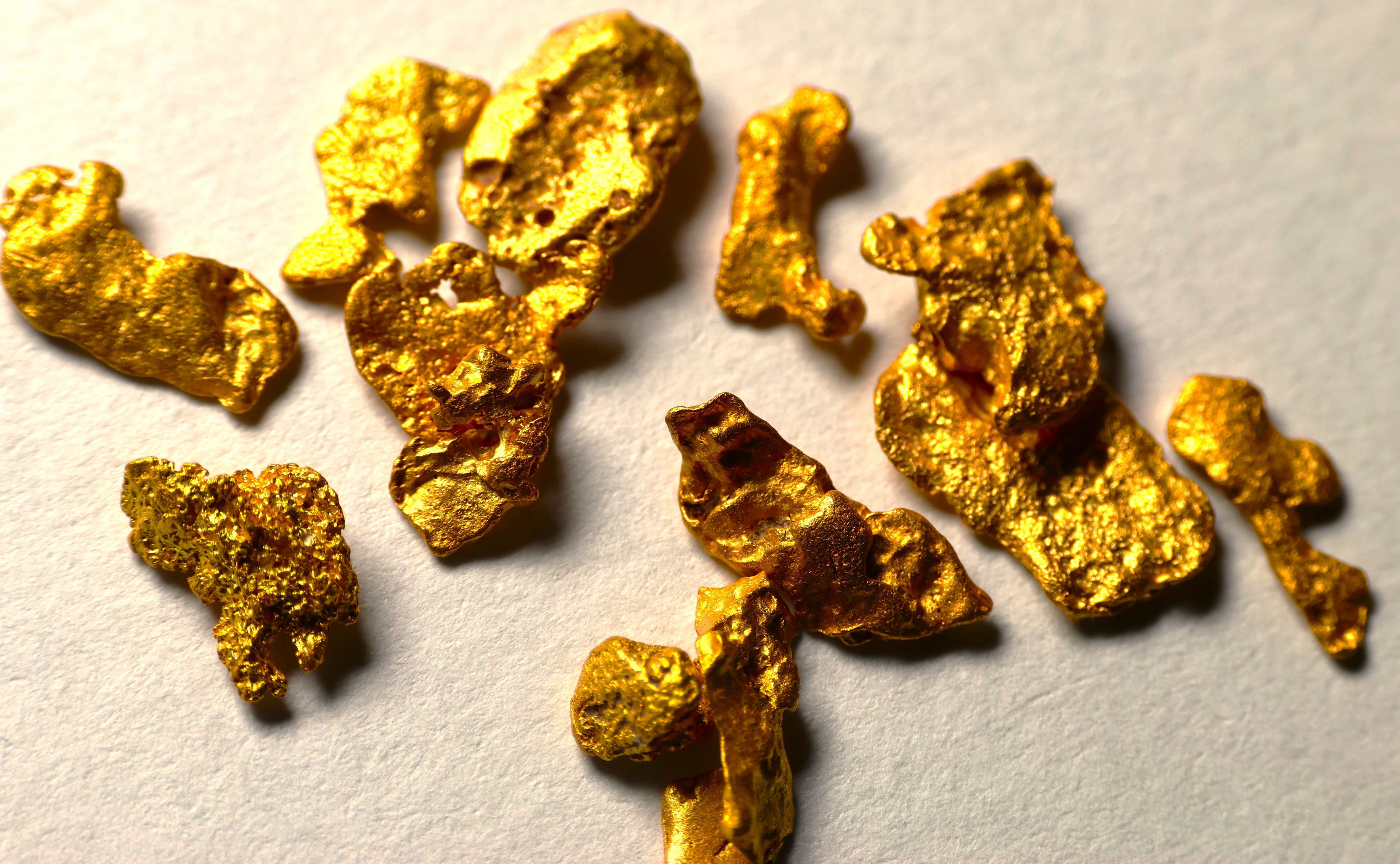 Gold nuggets on a textured surface