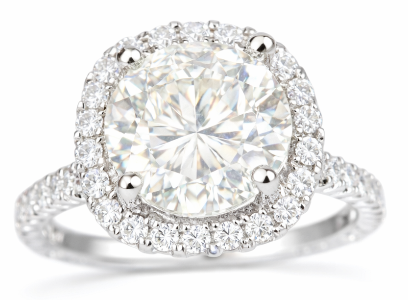 Diamond ring with a halo on a white background