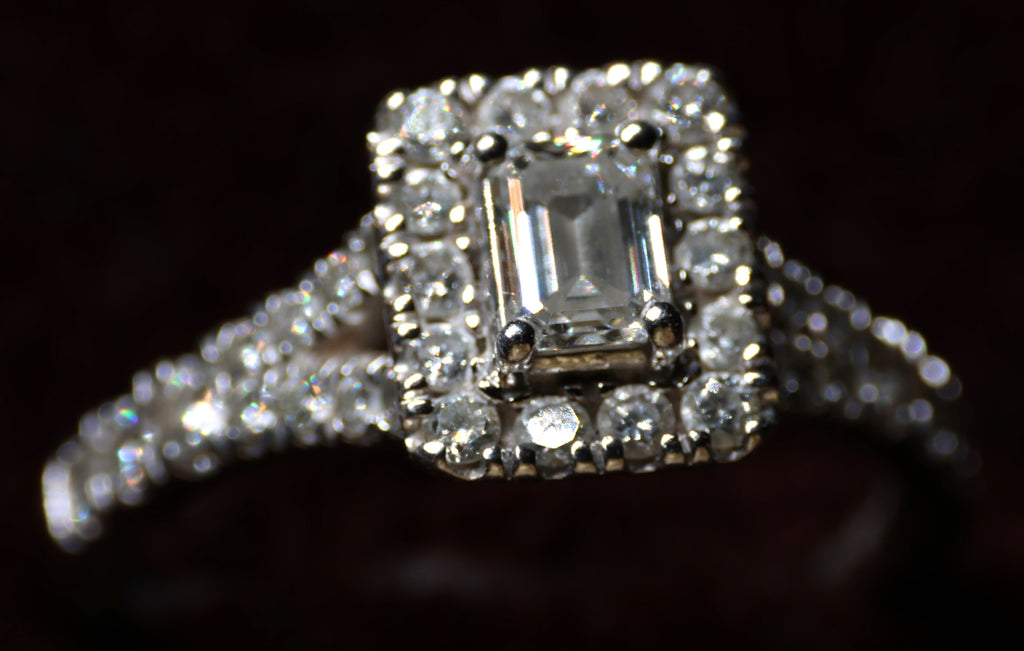 0.78 Carat Emerald cut diamond in a platinum halo setting