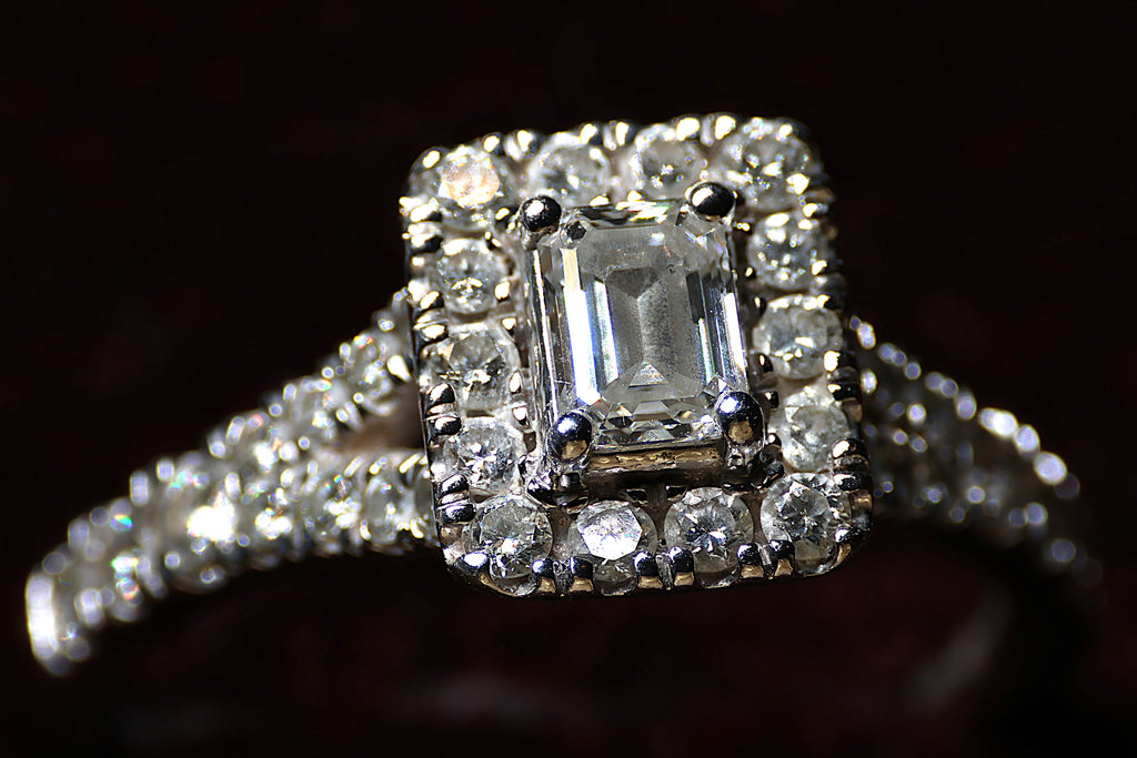 0.78 Carat Emerald cut diamond in a platinum halo setting