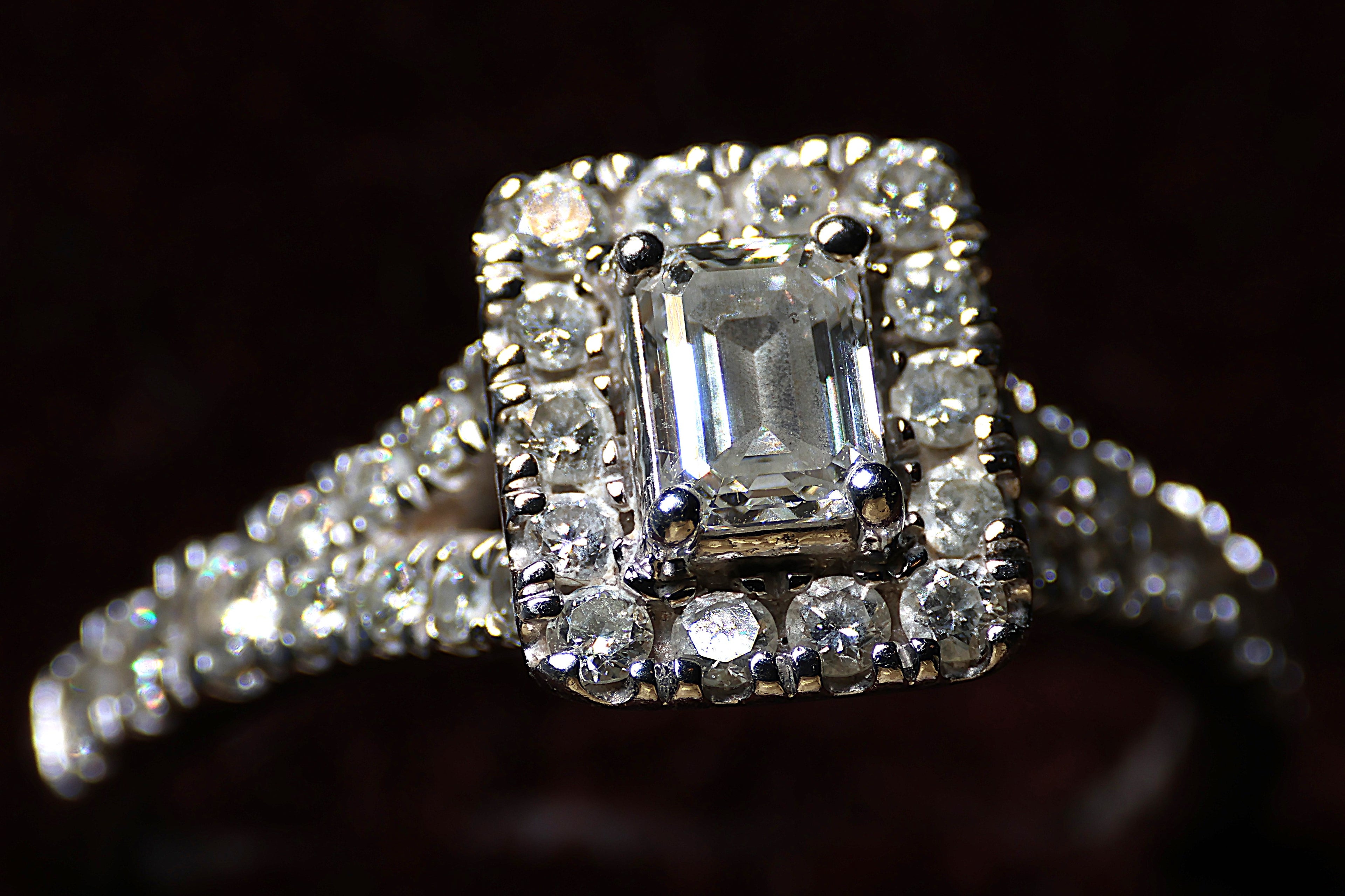 0.78 Carat Emerald cut diamond in a platinum halo setting