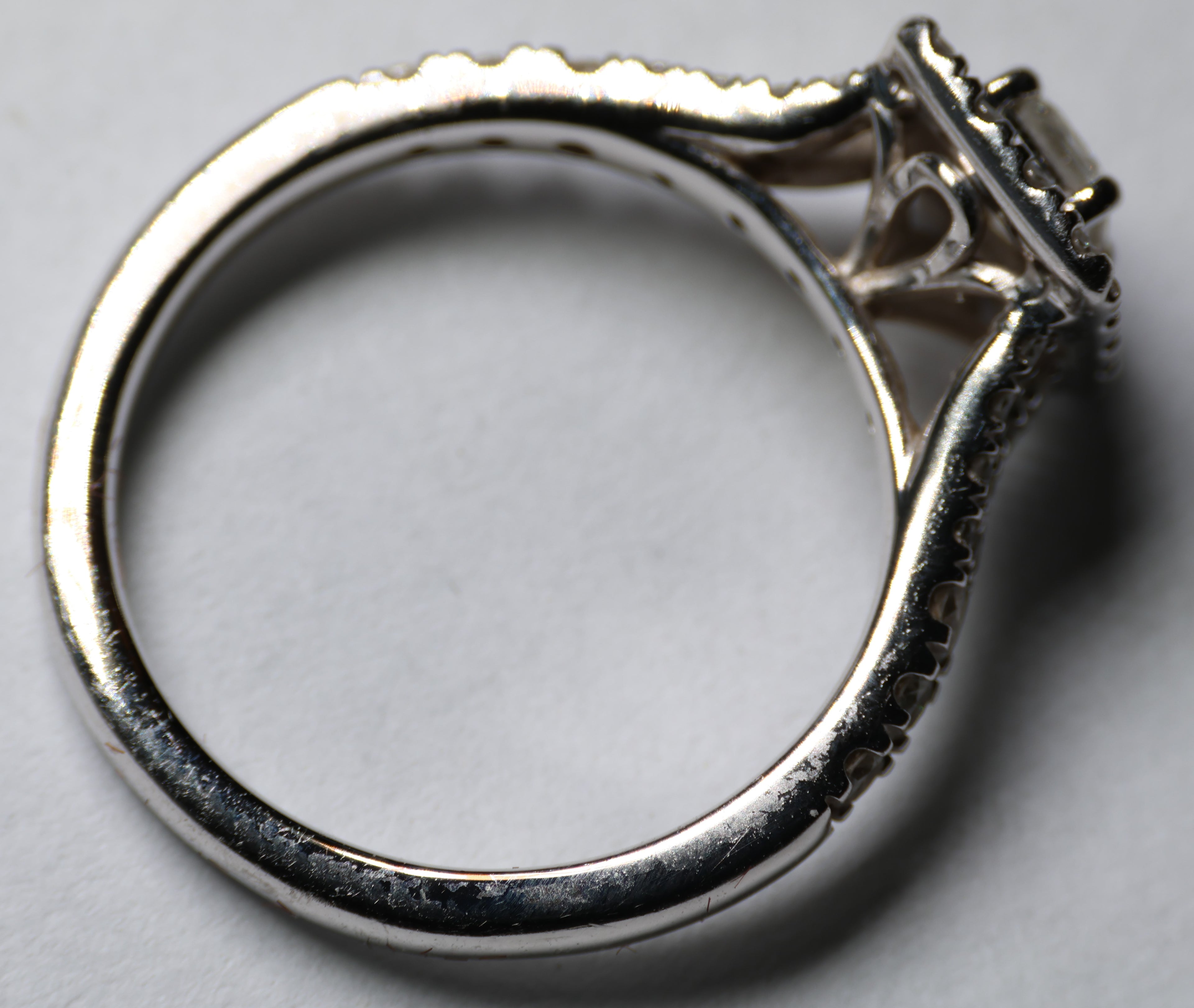 0.78 Carat Emerald cut diamond in a platinum halo setting