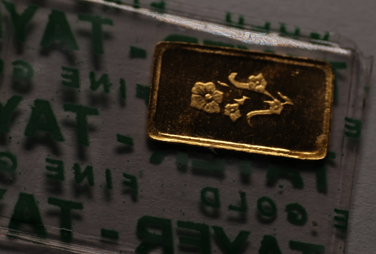 Reverse view of the 1 Gram Tayer Gold Bar