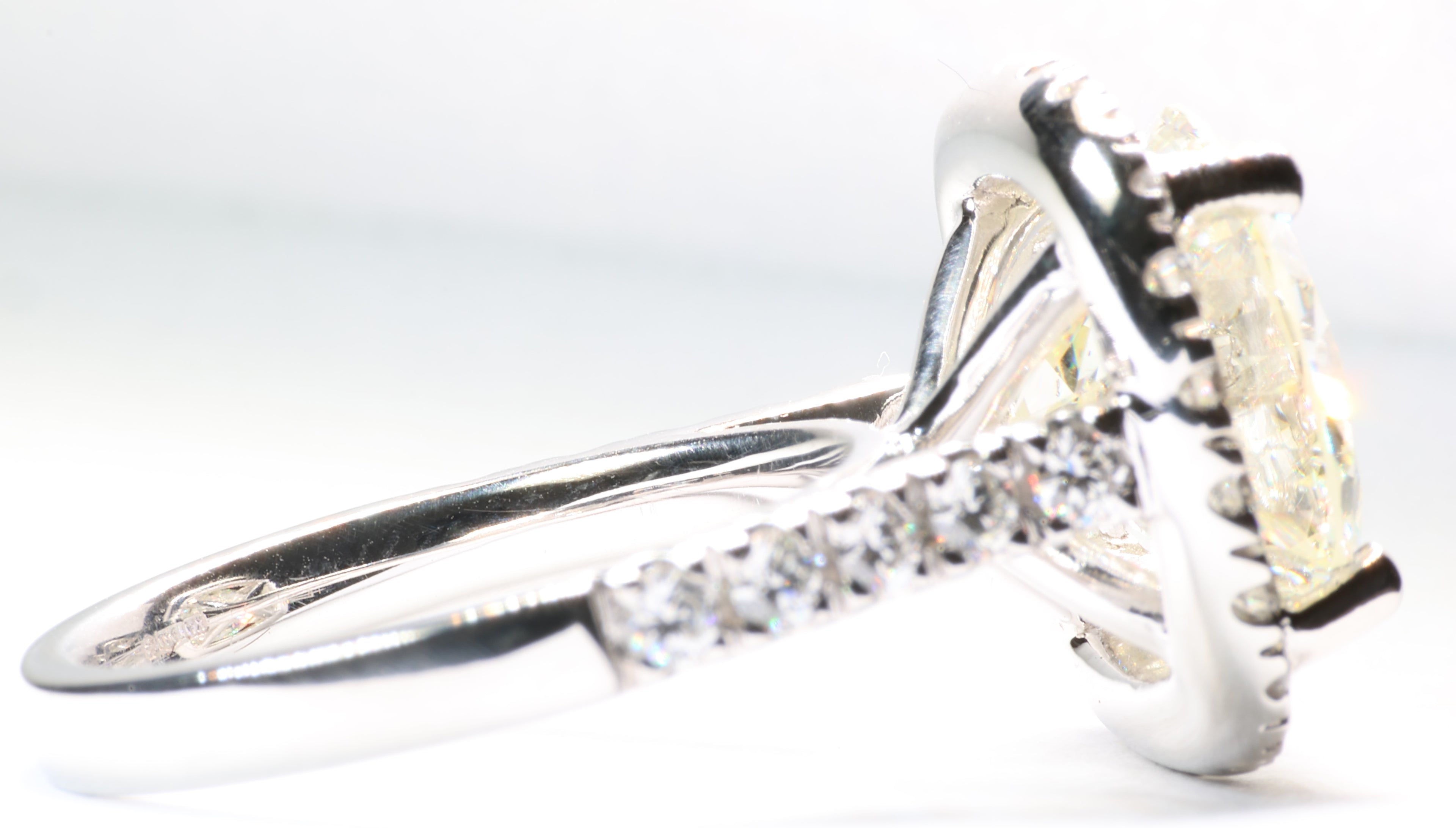 5.75 Round Brilliant Cut Diamond set in a platinum square halo setting