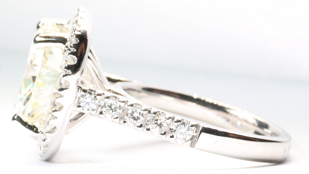 5.75 Round Brilliant Cut Diamond set in a platinum square halo setting